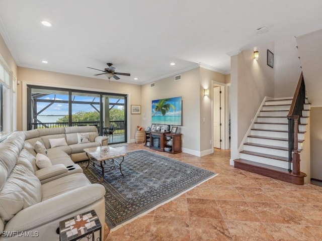 living room featuring ceiling fan and crown molding