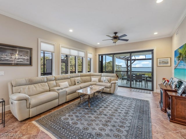 living room with ceiling fan and crown molding