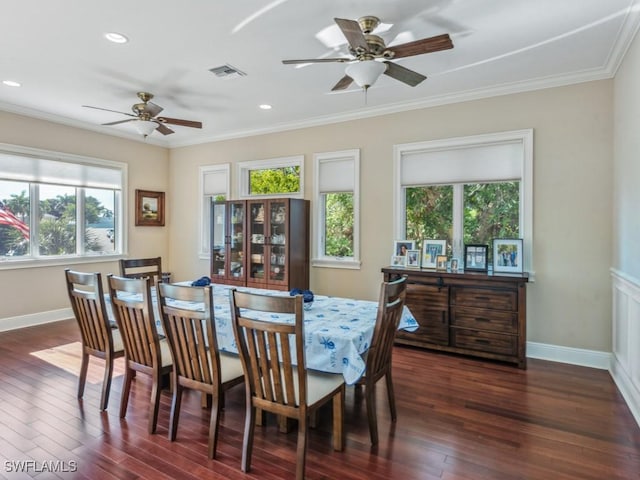 dining area featuring ceiling fan, ornamental molding, and dark wood-type flooring