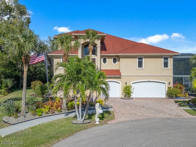 mediterranean / spanish-style home featuring a garage