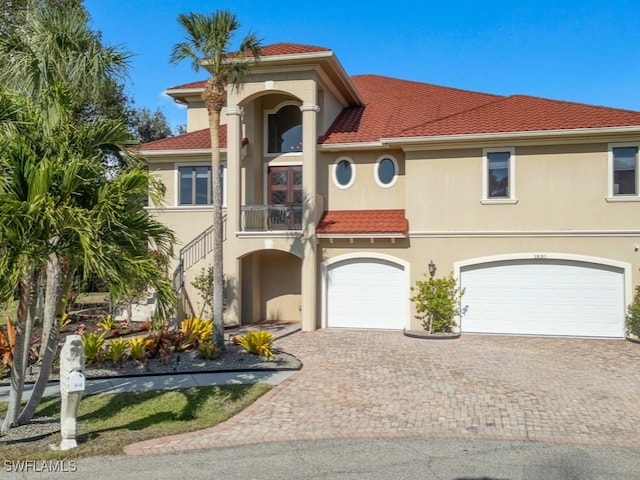 mediterranean / spanish home with a garage