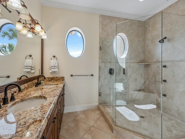 bathroom with a notable chandelier, tile patterned floors, an enclosed shower, vanity, and ornamental molding