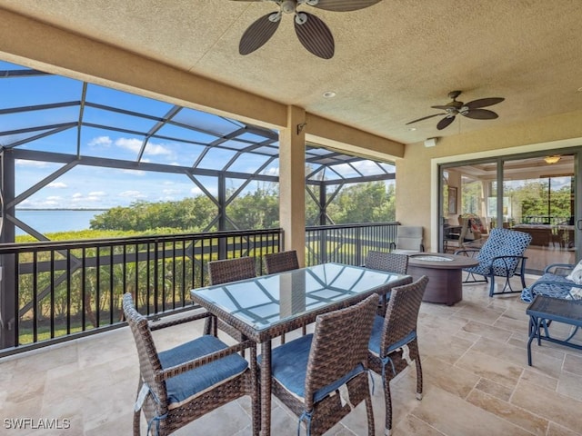 view of patio / terrace with a lanai and ceiling fan