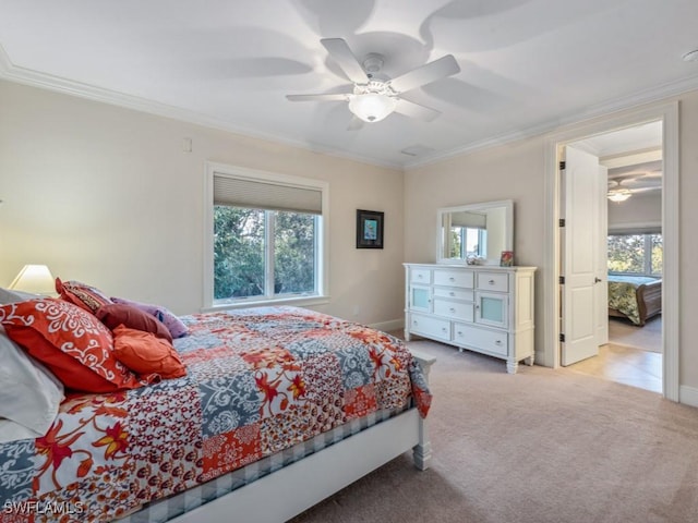 bedroom with light colored carpet, ceiling fan, and ornamental molding