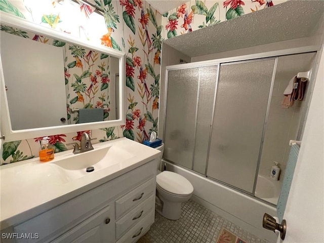 bathroom featuring enclosed tub / shower combo, tile patterned flooring, toilet, vanity, and wallpapered walls