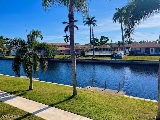 view of water feature with a boat dock and a residential view