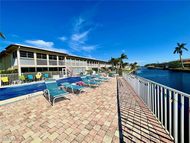 view of swimming pool with a water view