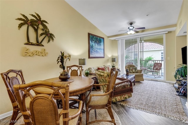 dining space featuring ceiling fan, hardwood / wood-style flooring, and lofted ceiling