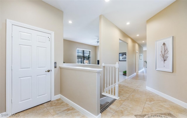 hallway with light tile patterned flooring