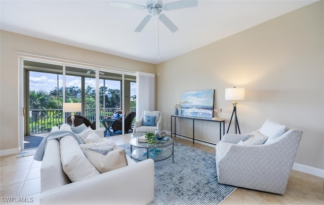 living room featuring light tile patterned floors and ceiling fan