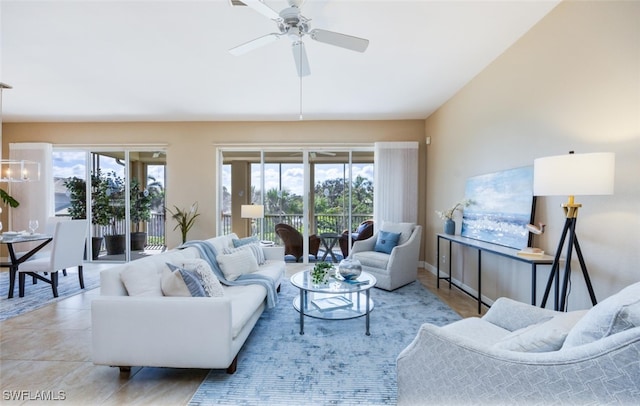 tiled living room with vaulted ceiling and ceiling fan