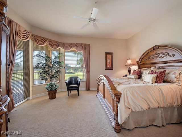 bedroom featuring access to outside, ceiling fan, and light carpet