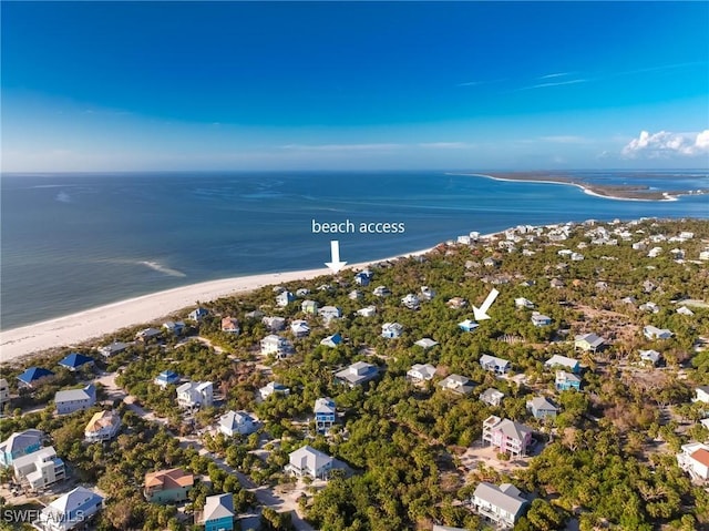 drone / aerial view with a view of the beach and a water view