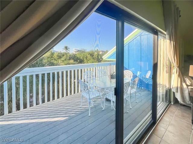 564 Coral Cir, Captiva, FL 33924 - view of wooden balcony featuring outdoor dining area and a deck