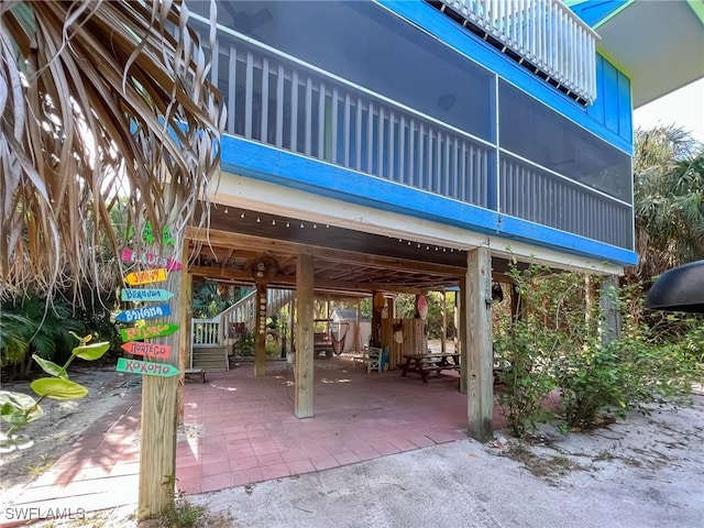564 Coral Cir, Captiva, FL 33924 - patio / terrace with a carport and stairway