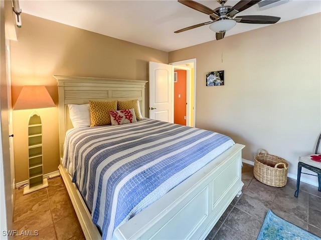 564 Coral Cir, Captiva, FL 33924 - tiled bedroom with ceiling fan and baseboards