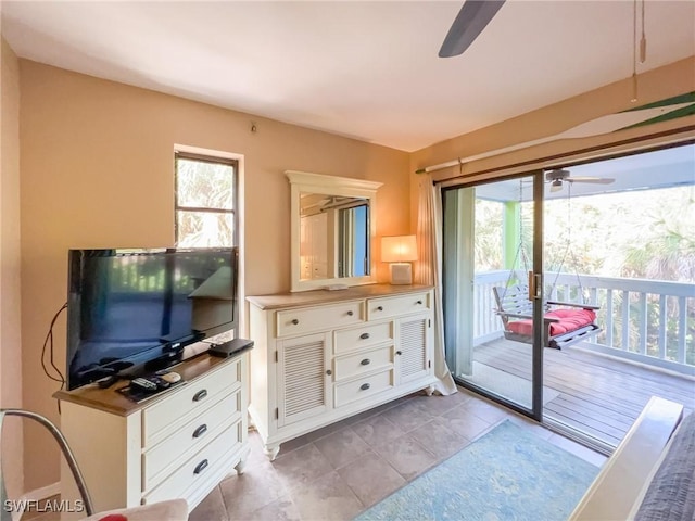 564 Coral Cir, Captiva, FL 33924 - living area with a ceiling fan, plenty of natural light, and light tile patterned flooring