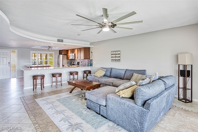 living room featuring ceiling fan