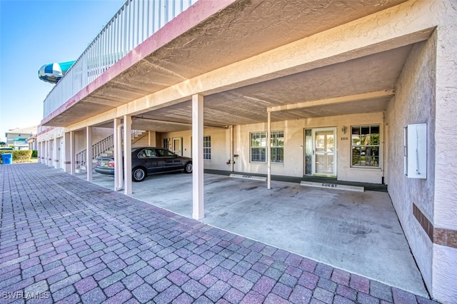 view of vehicle parking featuring a carport