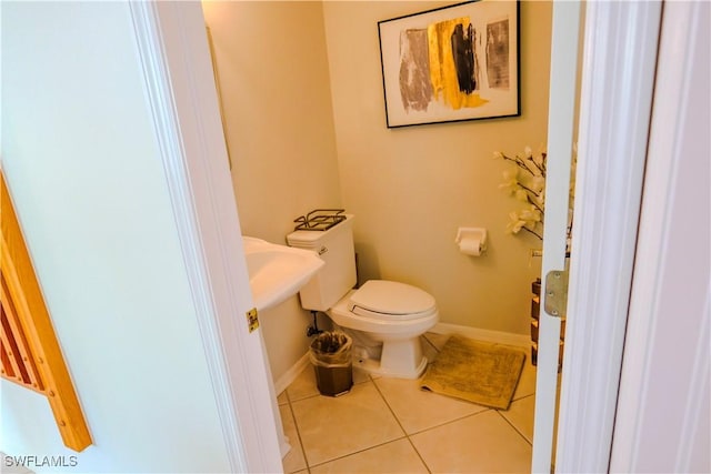 bathroom featuring tile patterned floors and toilet