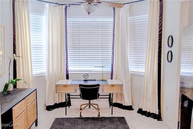 tiled office featuring ceiling fan