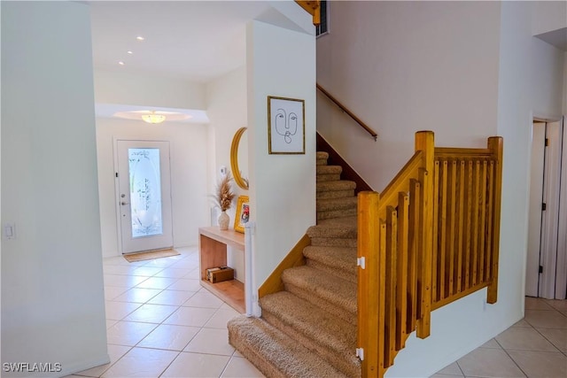 staircase with tile patterned flooring