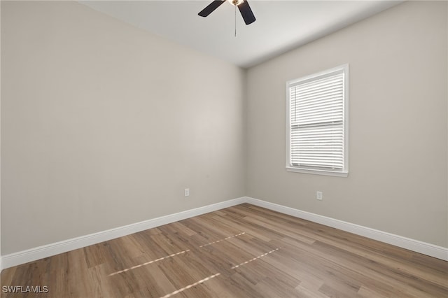 empty room featuring light hardwood / wood-style flooring and ceiling fan