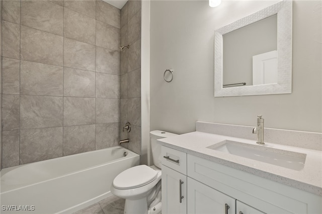 full bathroom featuring vanity, toilet, and tiled shower / bath