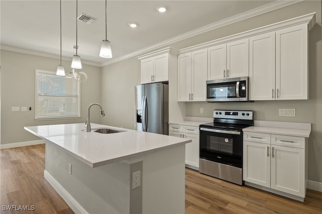 kitchen featuring stainless steel appliances, sink, light hardwood / wood-style floors, white cabinetry, and an island with sink