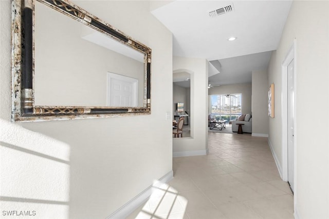 hallway featuring light tile patterned floors