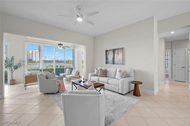 living room featuring ceiling fan and light tile patterned floors