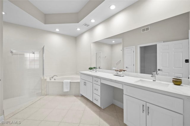 bathroom with tile patterned flooring, vanity, and independent shower and bath