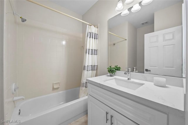 bathroom featuring tile patterned floors, vanity, and shower / bath combo