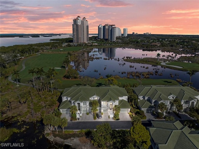 aerial view at dusk with a water view