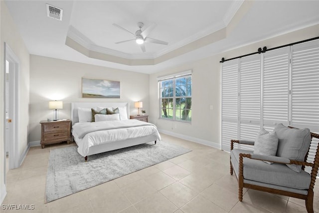 bedroom with ceiling fan, a raised ceiling, light tile patterned floors, and ornamental molding