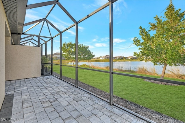 unfurnished sunroom with a water view