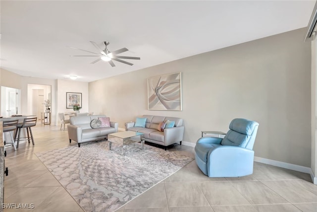 tiled living room with ceiling fan