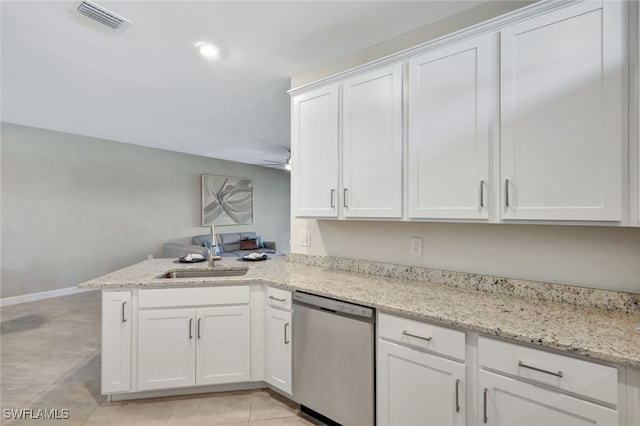 kitchen featuring white cabinetry, sink, light stone counters, stainless steel dishwasher, and kitchen peninsula