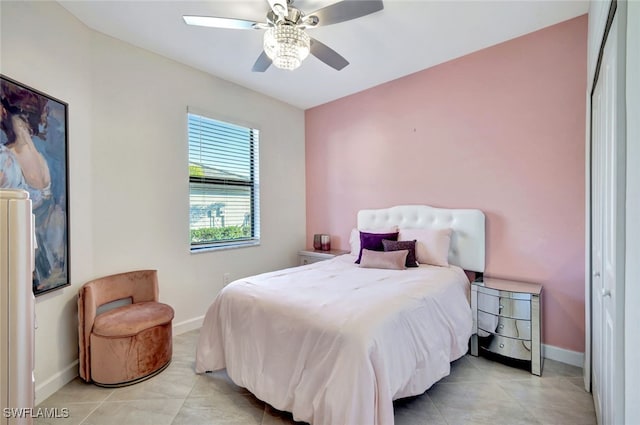 tiled bedroom with a closet and ceiling fan