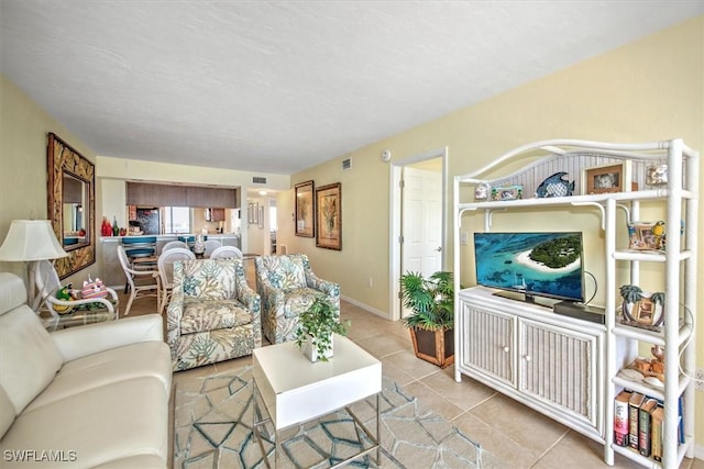 living room with light tile patterned floors