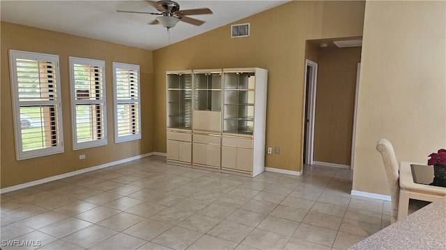 interior space with vaulted ceiling, ceiling fan, and a healthy amount of sunlight