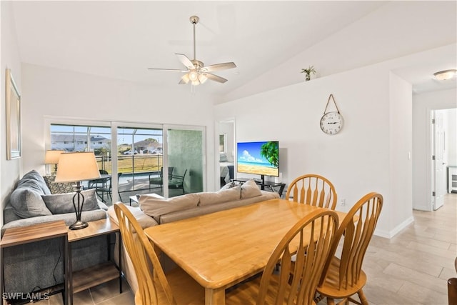 dining room featuring ceiling fan and lofted ceiling