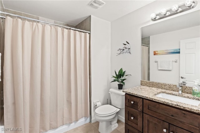 bathroom featuring a shower with shower curtain, tile patterned floors, vanity, and toilet