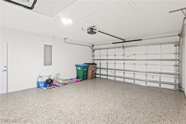 garage with electric panel and a garage door opener