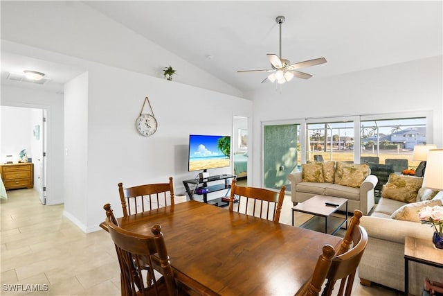 dining space featuring ceiling fan and vaulted ceiling