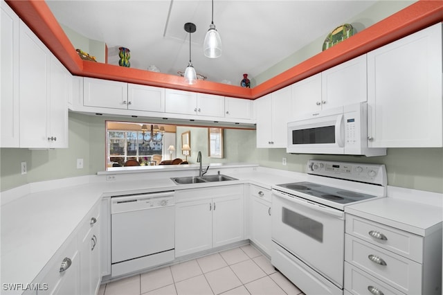 kitchen featuring pendant lighting, white appliances, sink, and white cabinets