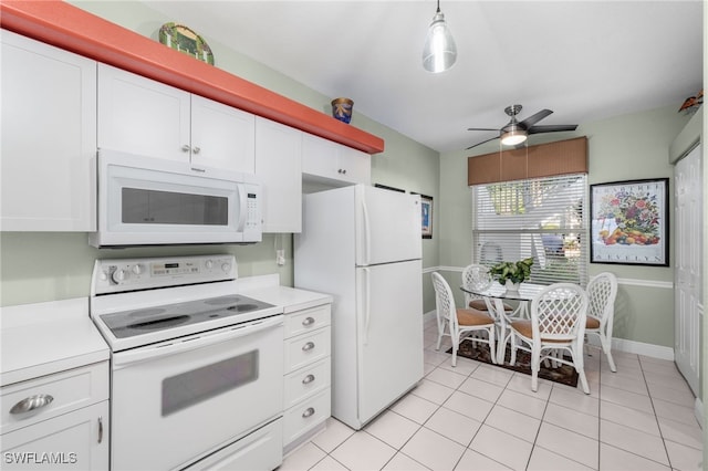 kitchen featuring white cabinetry, light tile patterned floors, ceiling fan, pendant lighting, and white appliances