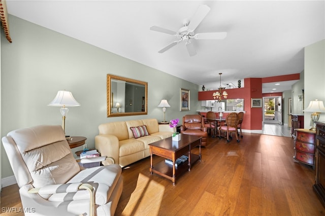 living room featuring hardwood / wood-style flooring and ceiling fan