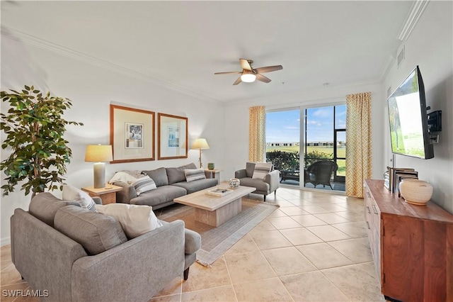 tiled living room featuring ceiling fan and ornamental molding