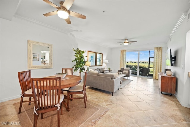 dining space with ceiling fan, light tile patterned floors, and crown molding